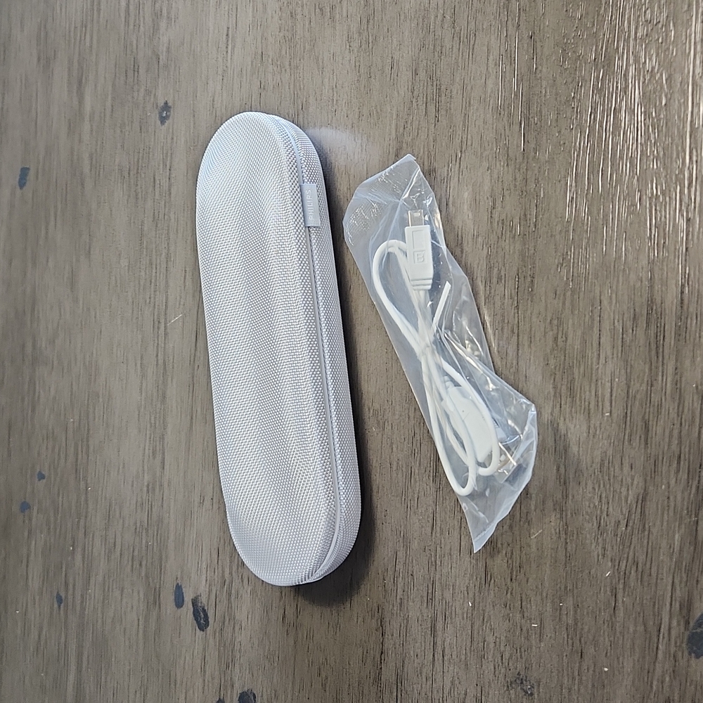 Philips Sonicare DiamondClean charging case with cord.